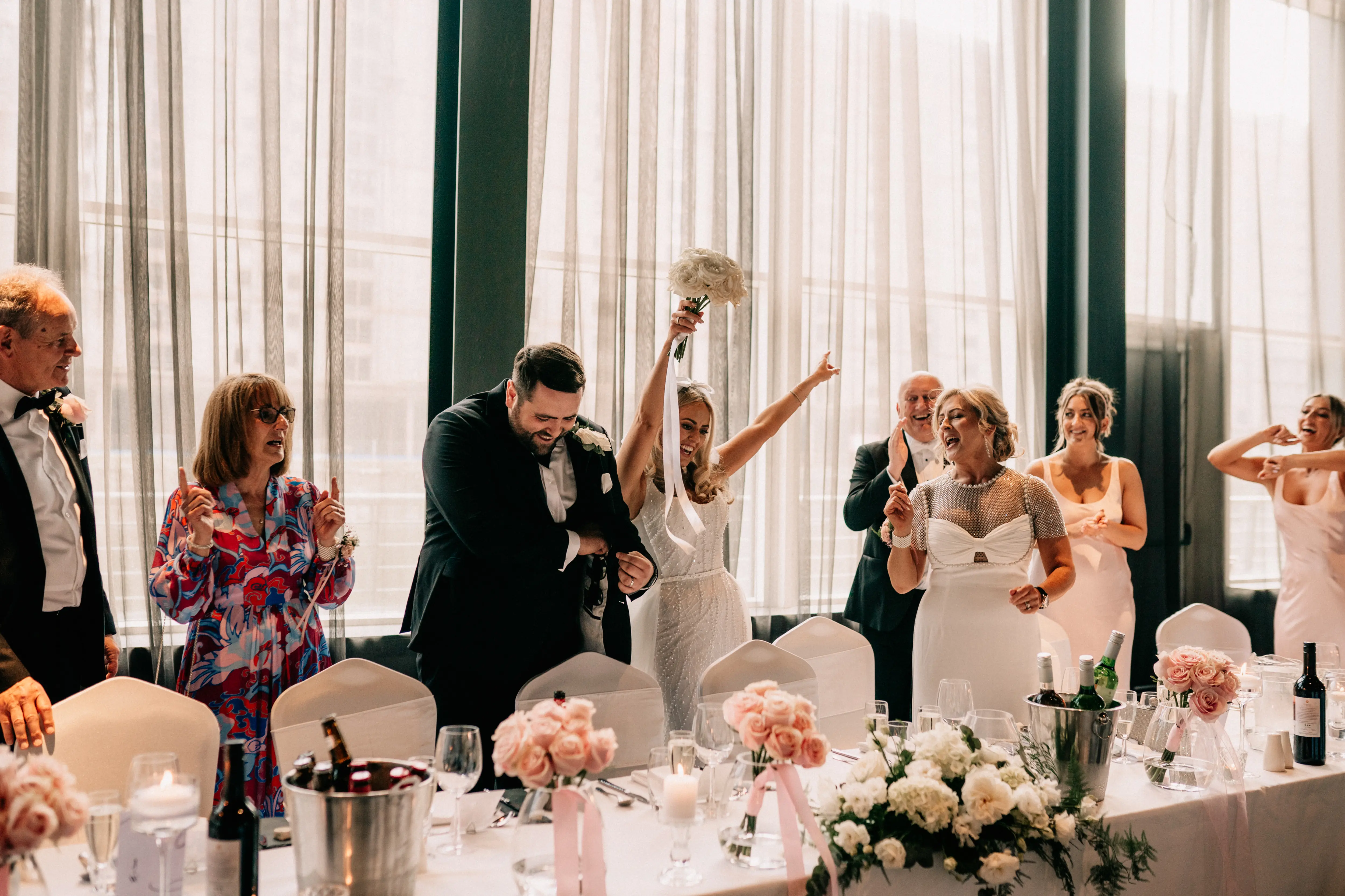 Long top table flowers, re using bridal bouquets and long and low flower design. Emilie May Photography